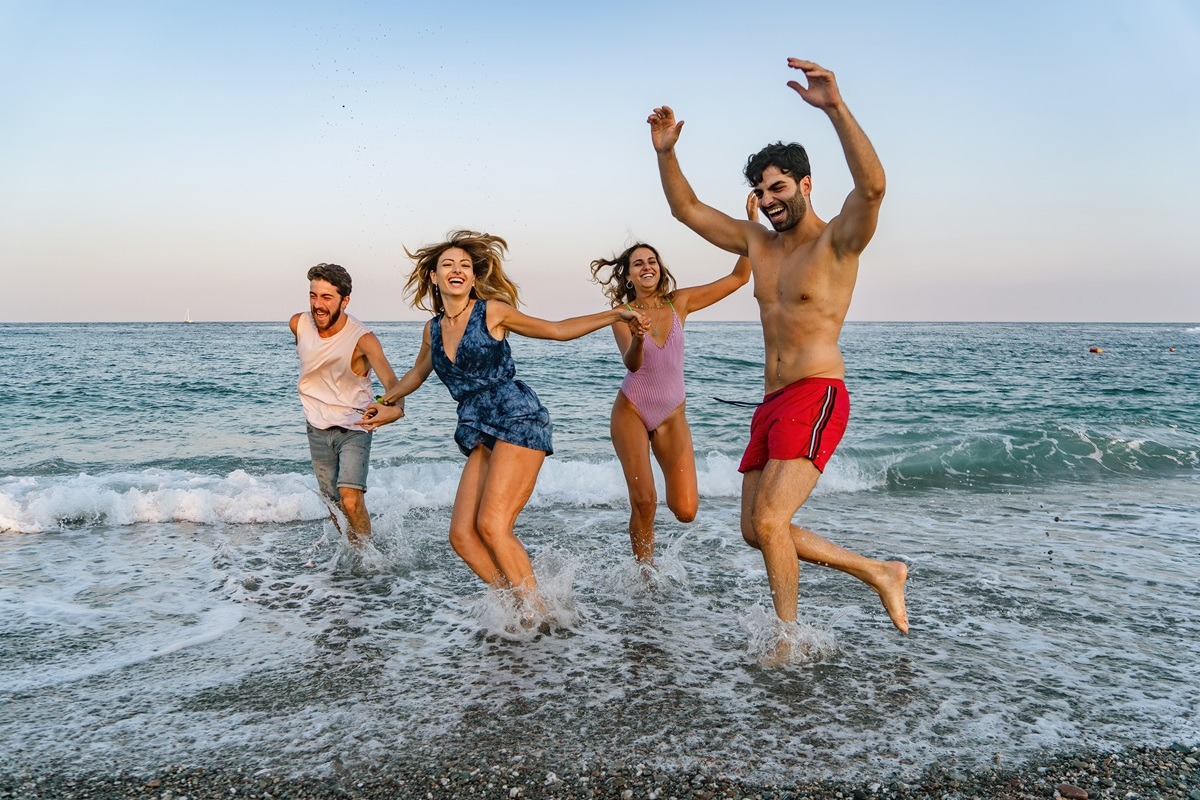 Group of friends having fun on the beach. Group of friends having fun on the beach.