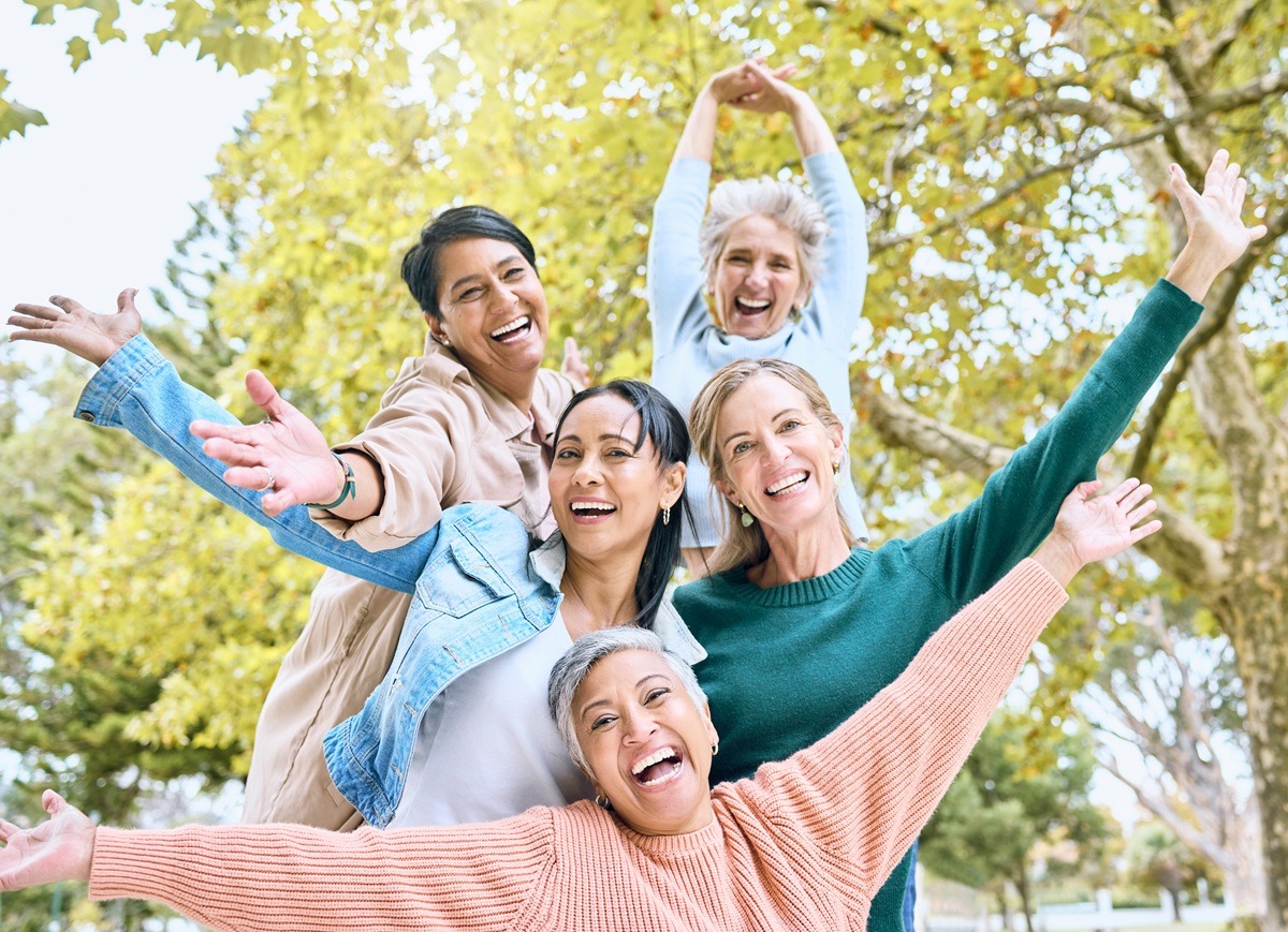 An image of senior holding their hands up in fun game, goofy activity. An image of senior holding their hands up in fun game, goofy activity.